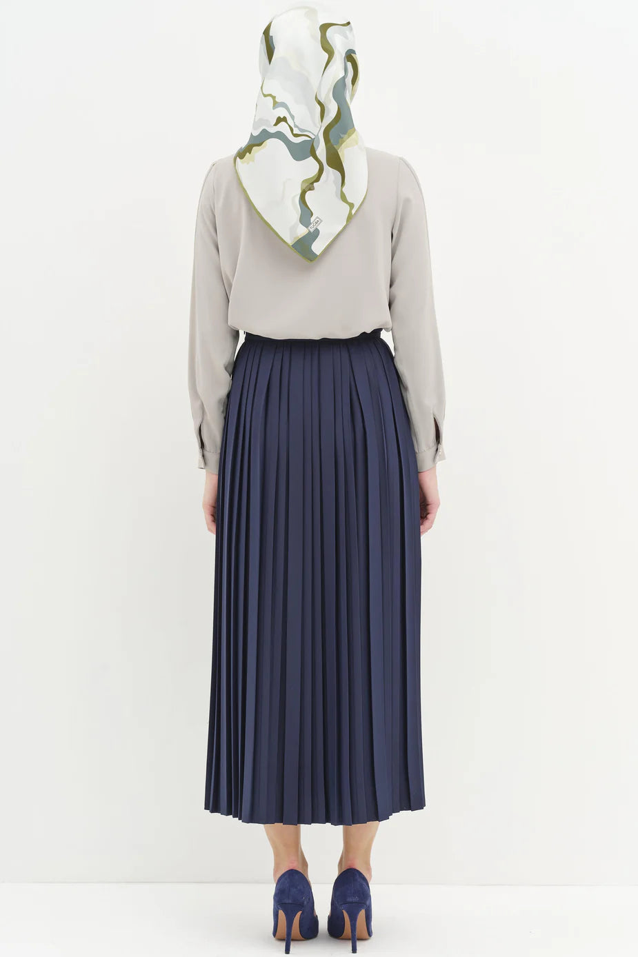 Jupe plissée avec accessoires en métal