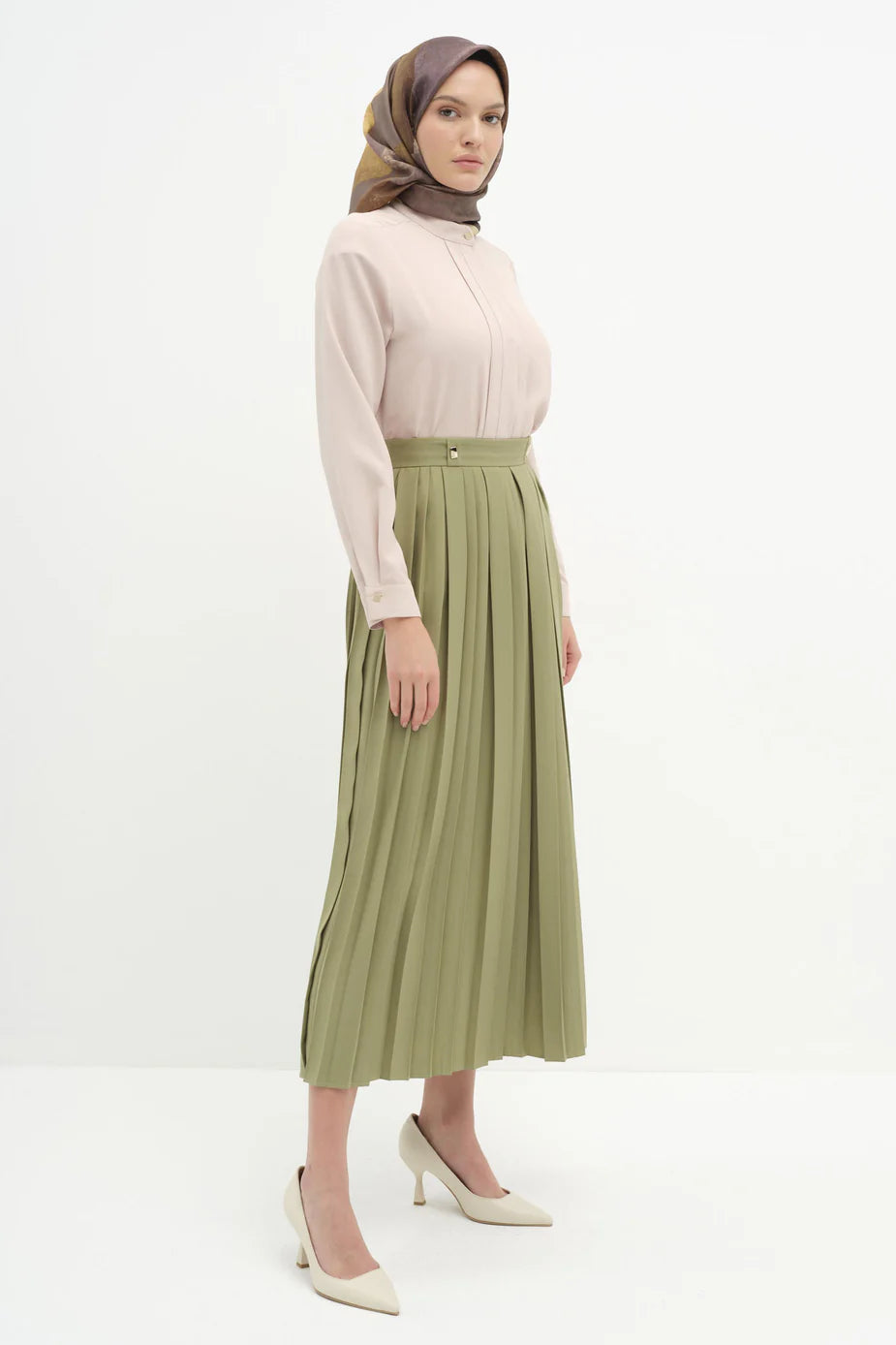 Jupe plissée avec accessoires en métal