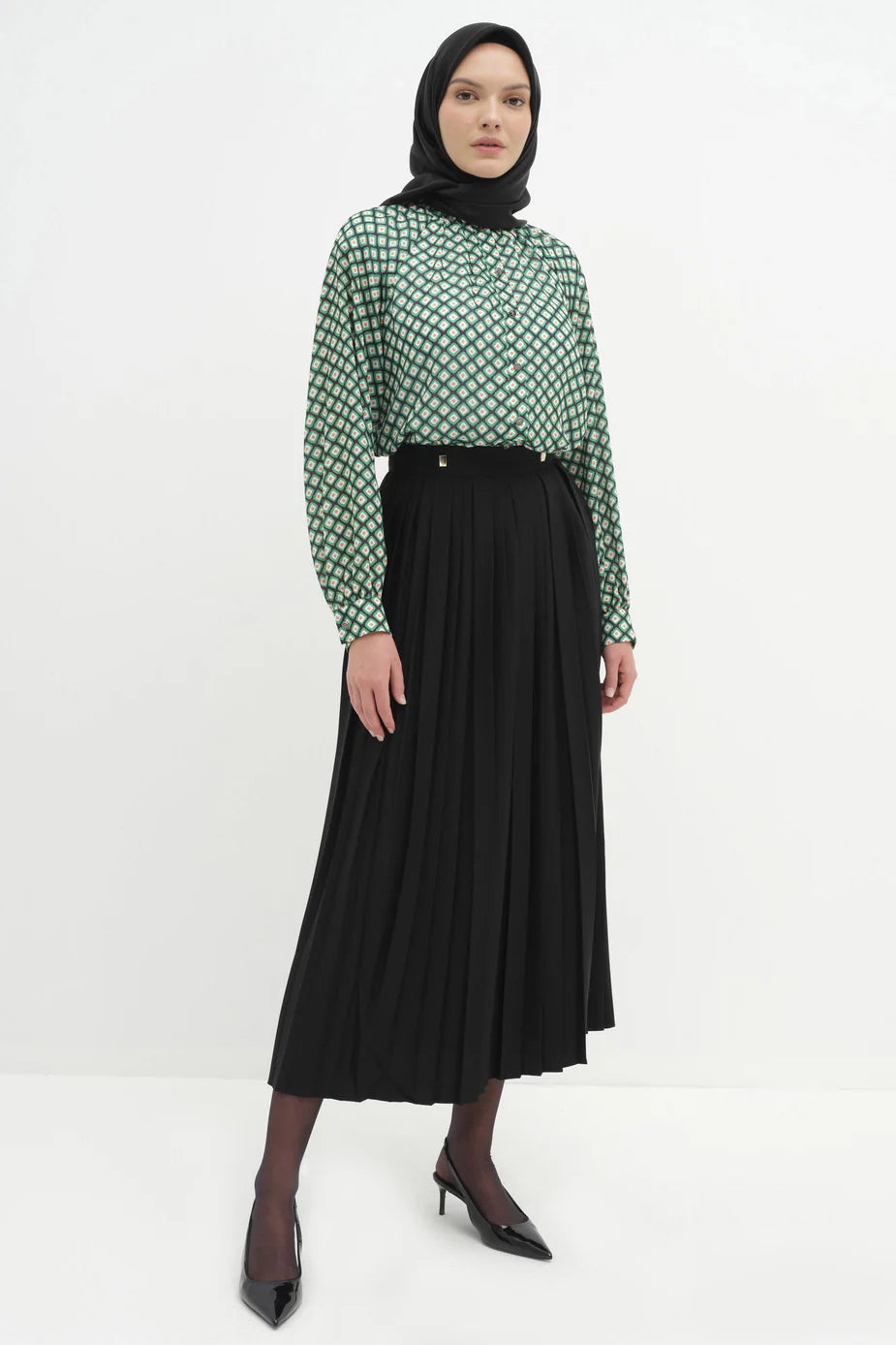 Jupe plissée avec accessoires en métal