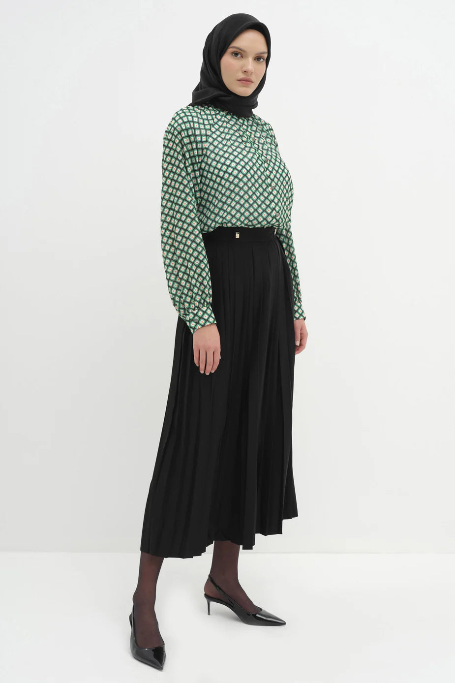 Jupe plissée avec accessoires en métal