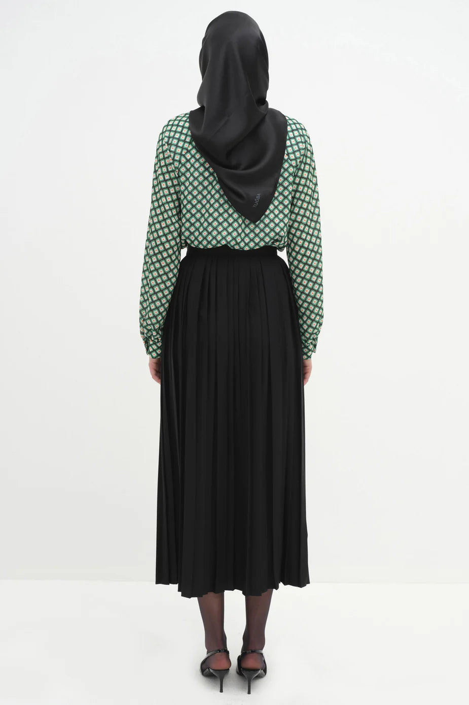 Jupe plissée avec accessoires en métal