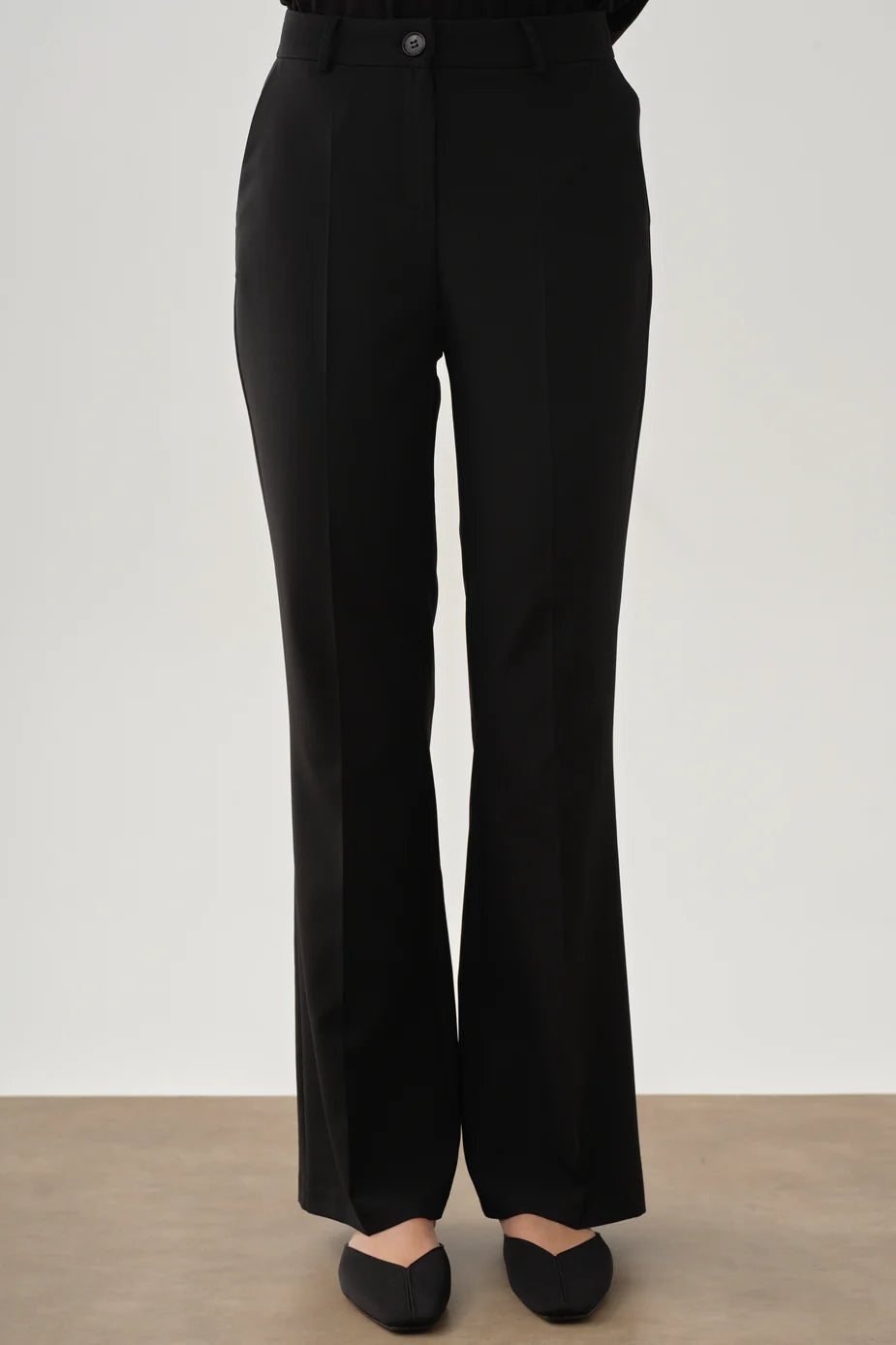 Pantalon à pinces et poches