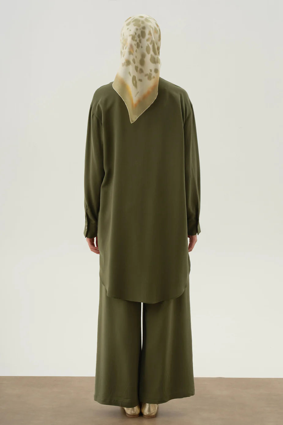 Tunique asymétrique à demi-patte