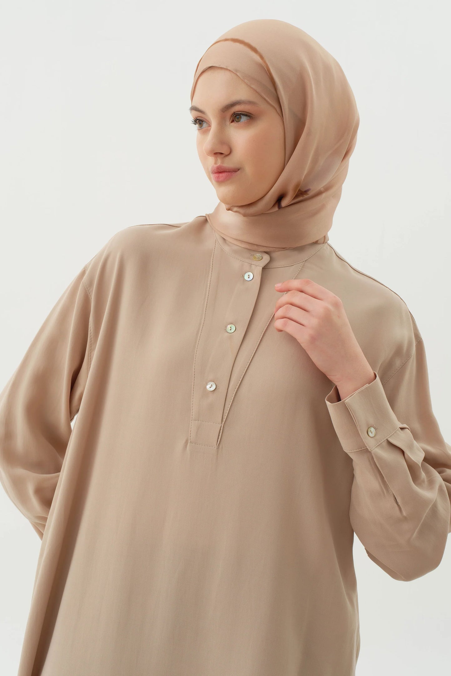 Tunique asymétrique à demi-patte