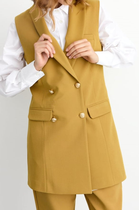 Veste sans manches avec des boutons en doré