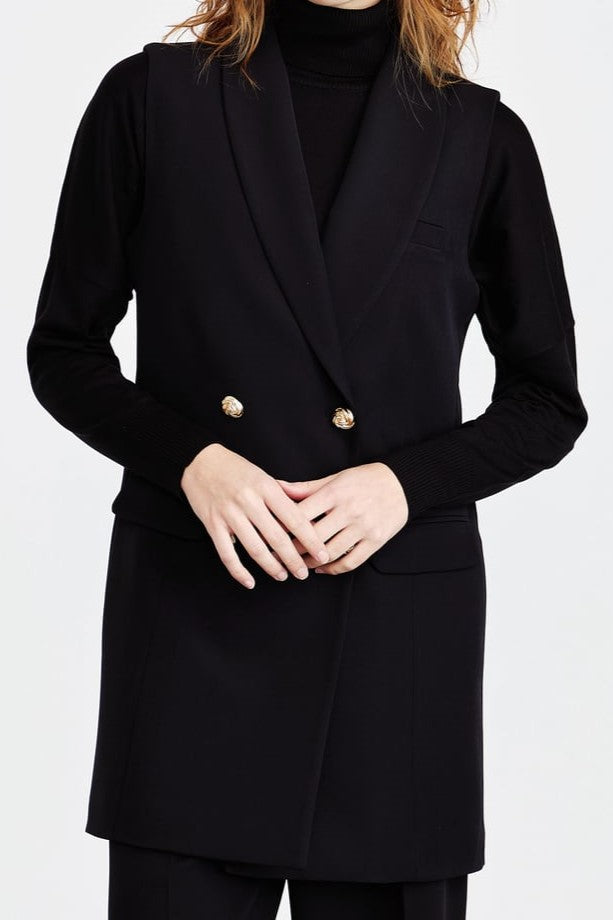 Veste sans manches avec des boutons en doré