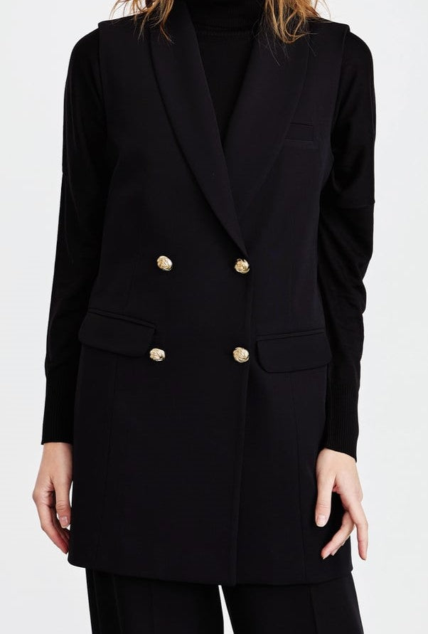 Veste sans manches avec des boutons en doré